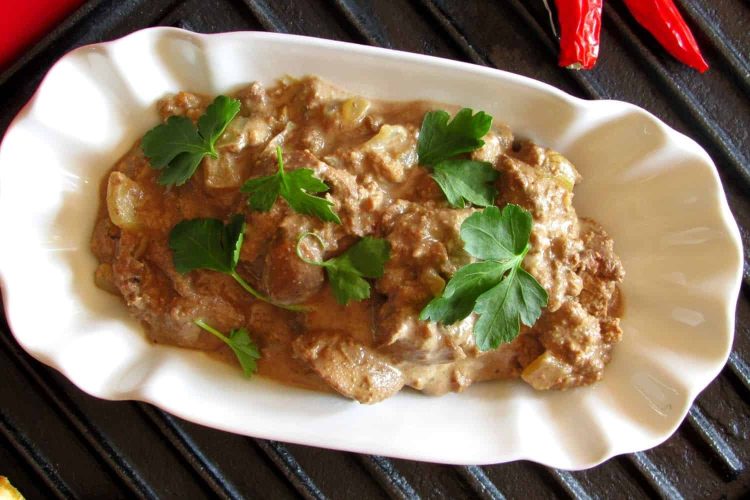 Chicken Livers Fried in Creamy Garlic Sauce and Served with Bread