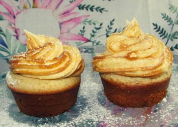 Vanilla Cupcakes Topped with a Swirl of Caramel Cream Cheese Icing
